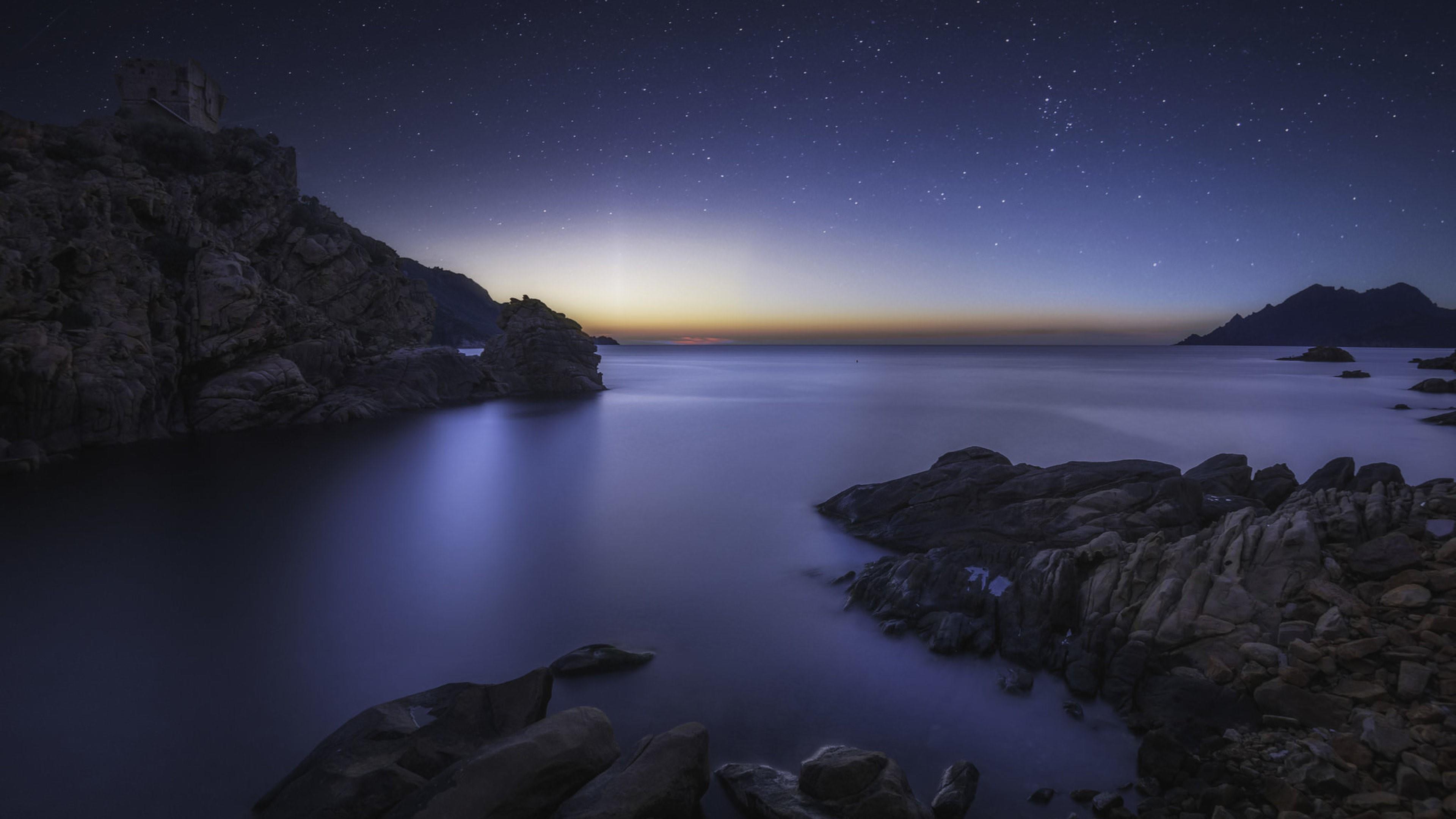 Rocky seashore at night wallpaper - backiee