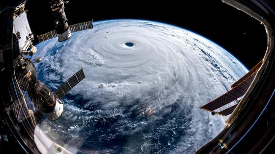 View from space from above on a hurricane tornado swirl of clouds and wind,  a storm front of bad weather and natural disaster. AI generated 28850533  Stock Photo at Vecteezy