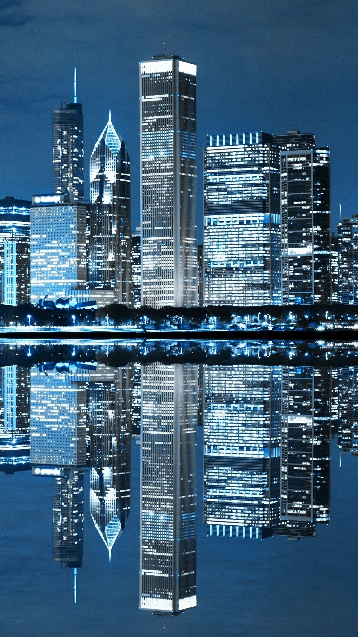 Chicago Skyline Reflected In The Lake Michigan Wallpaper Backiee