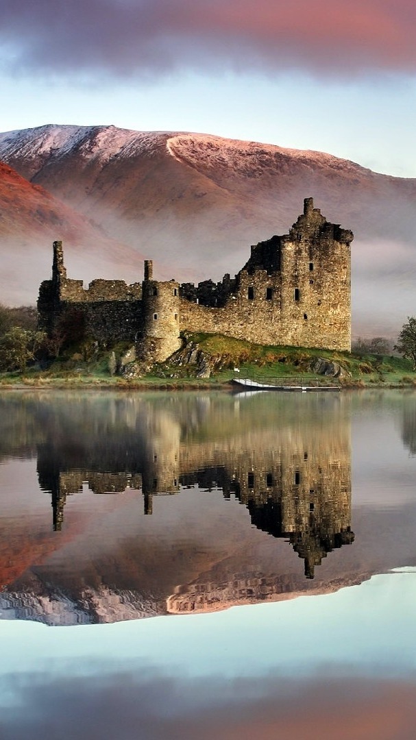 Reflection of Kilchurn Castle in Loch Awe, Highlands, Scotland - backiee