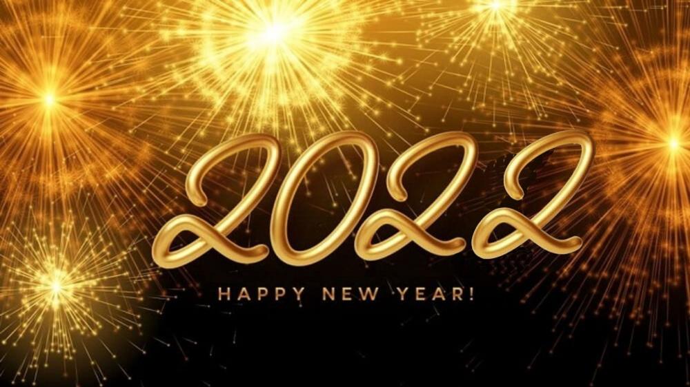 Happy New Year 2022 golden shiny background with bright burning fireworks wallpaper