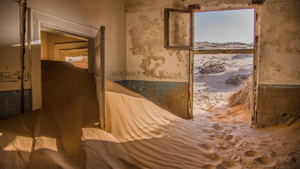 Sand swallowing a house in Namibia wallpaper