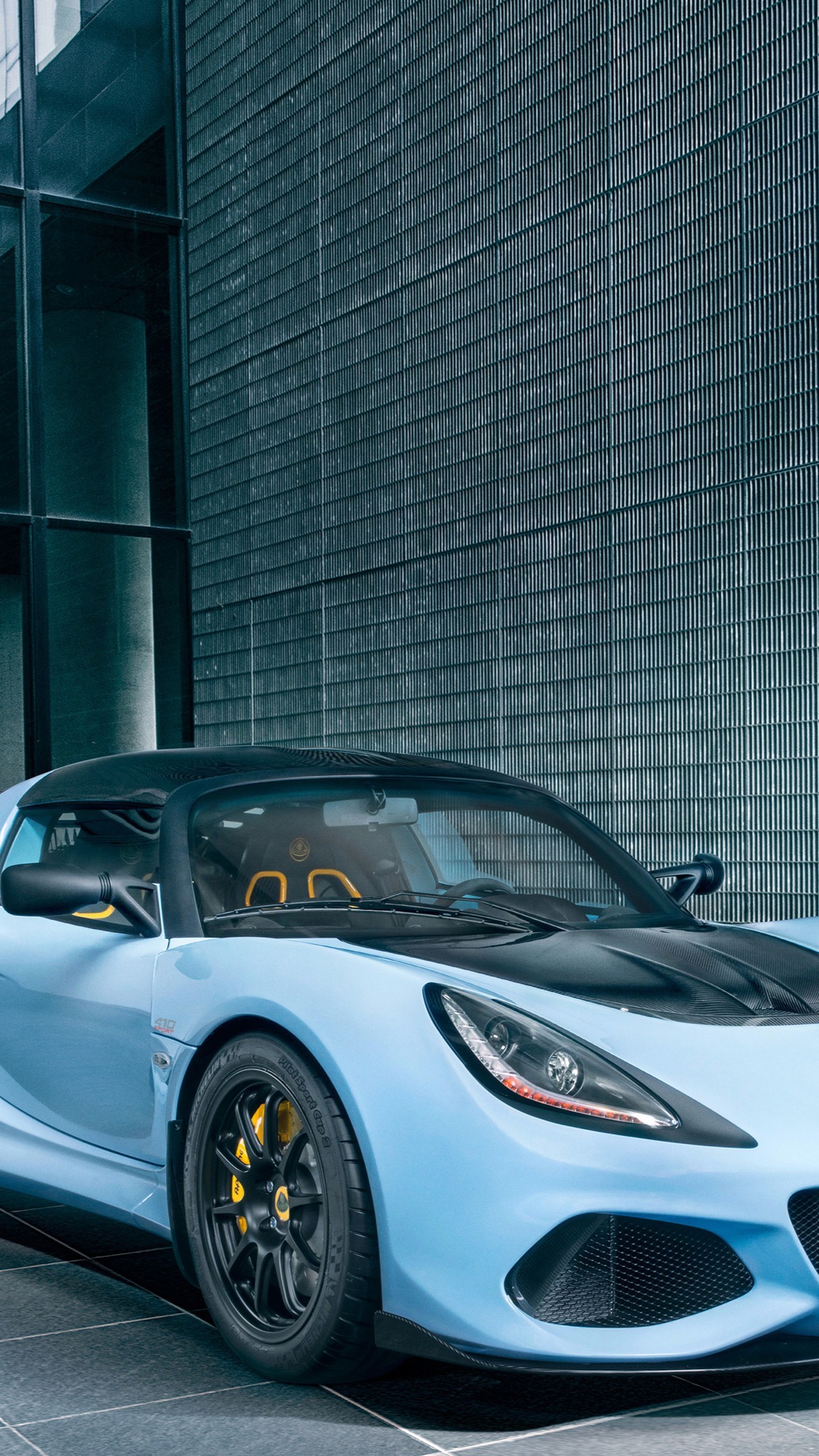 Sleek Blue Lotus Exige Sports Car Elegance Backiee